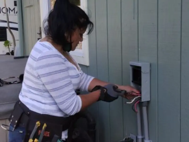 Licensed electrician wiring an exterior subpanel in Barkhamsted
