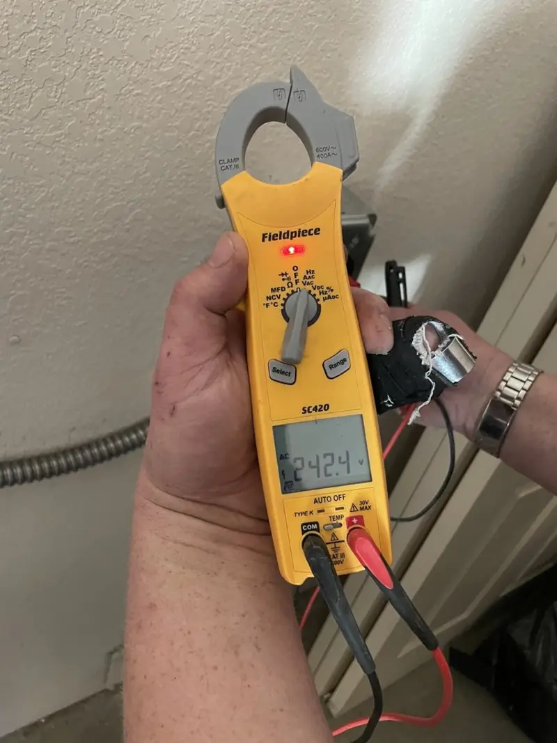 Voltage testing with clamp meter during Electrical Installation Services in Barkhamsted
